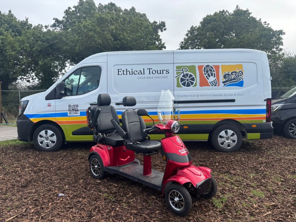 Twin Mobility Scooter in front of a van at a show