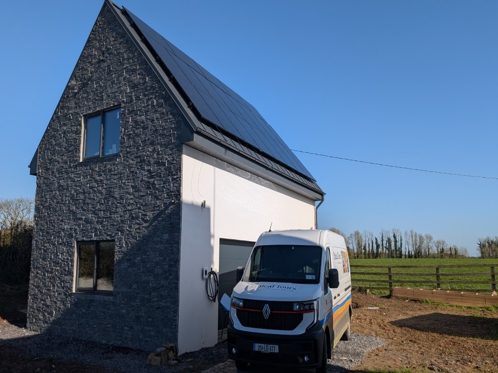 Van In front of new building with solar panels